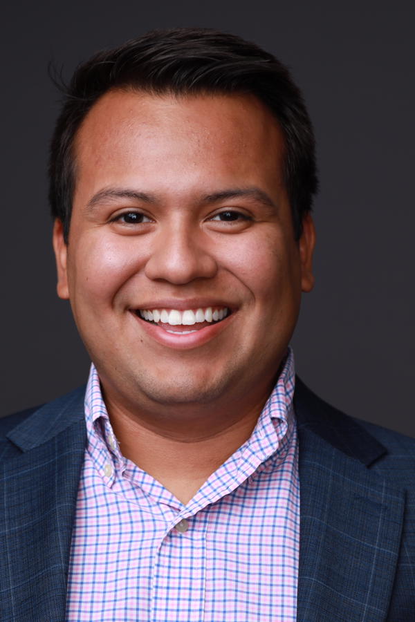 a person in a suit smiling