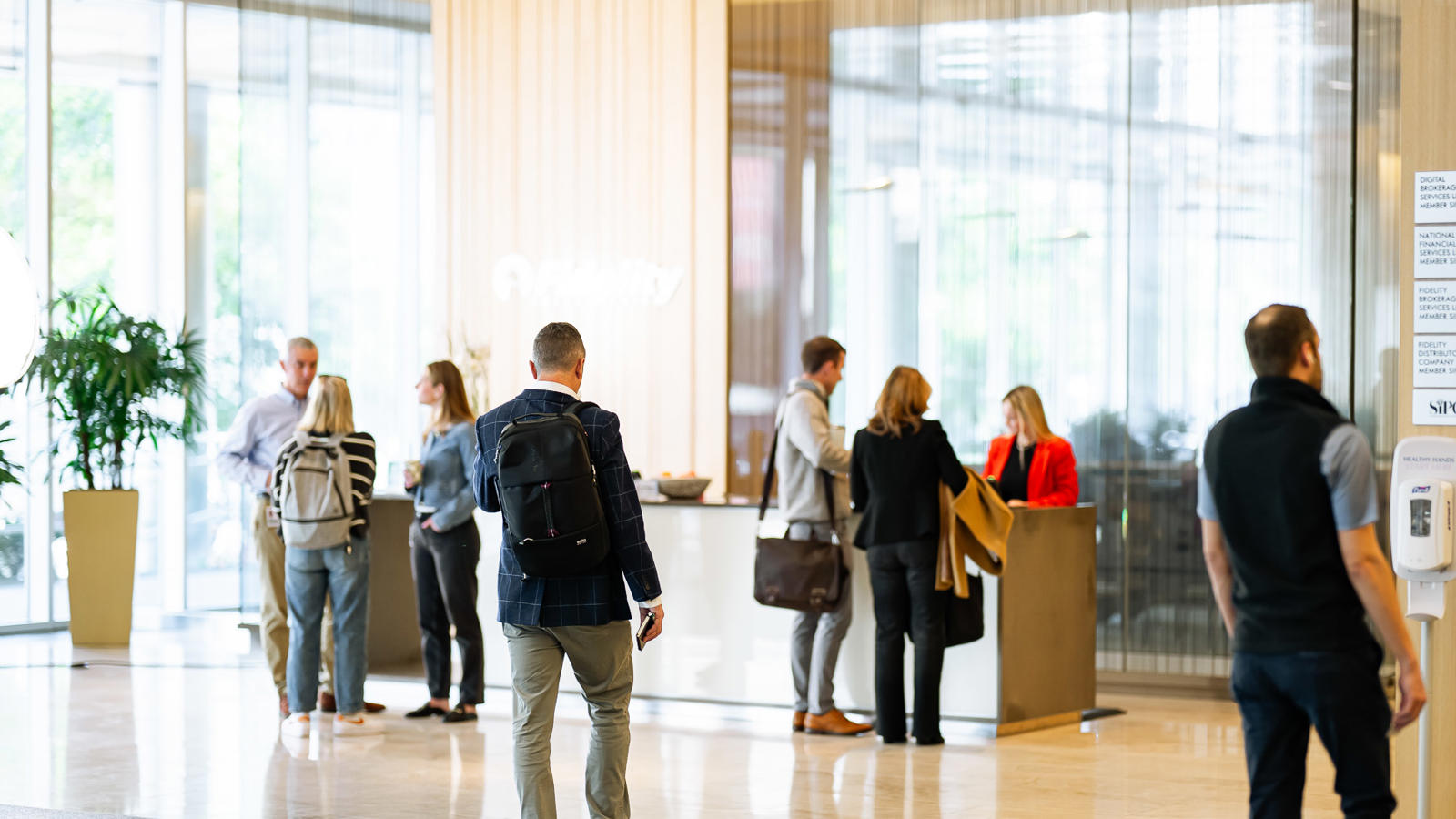a group of people standing in front of a counter